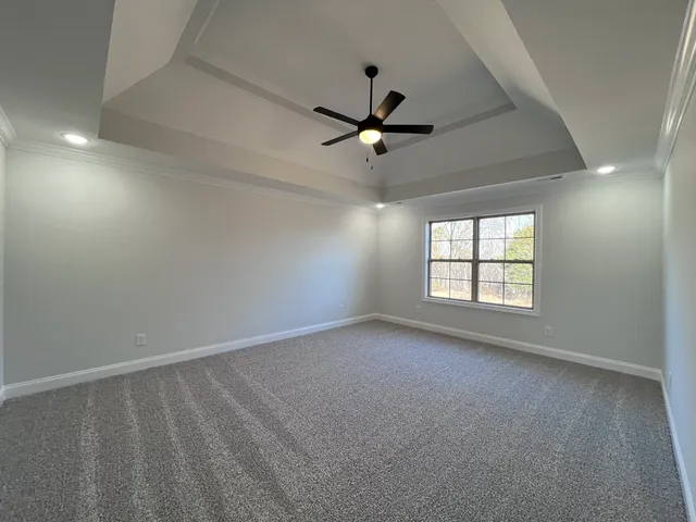 a dining room with furniture a chandelier and window