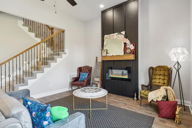 a bathroom with a granite countertop sink toilet a mirror and bathtub