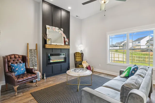 an empty room with closet and a chandelier fan