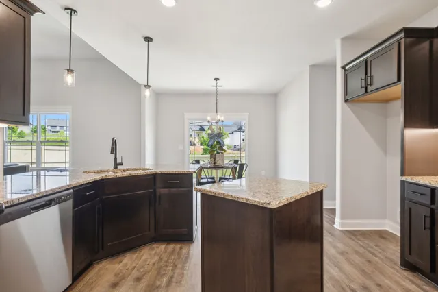 an empty room with closet and a chandelier fan