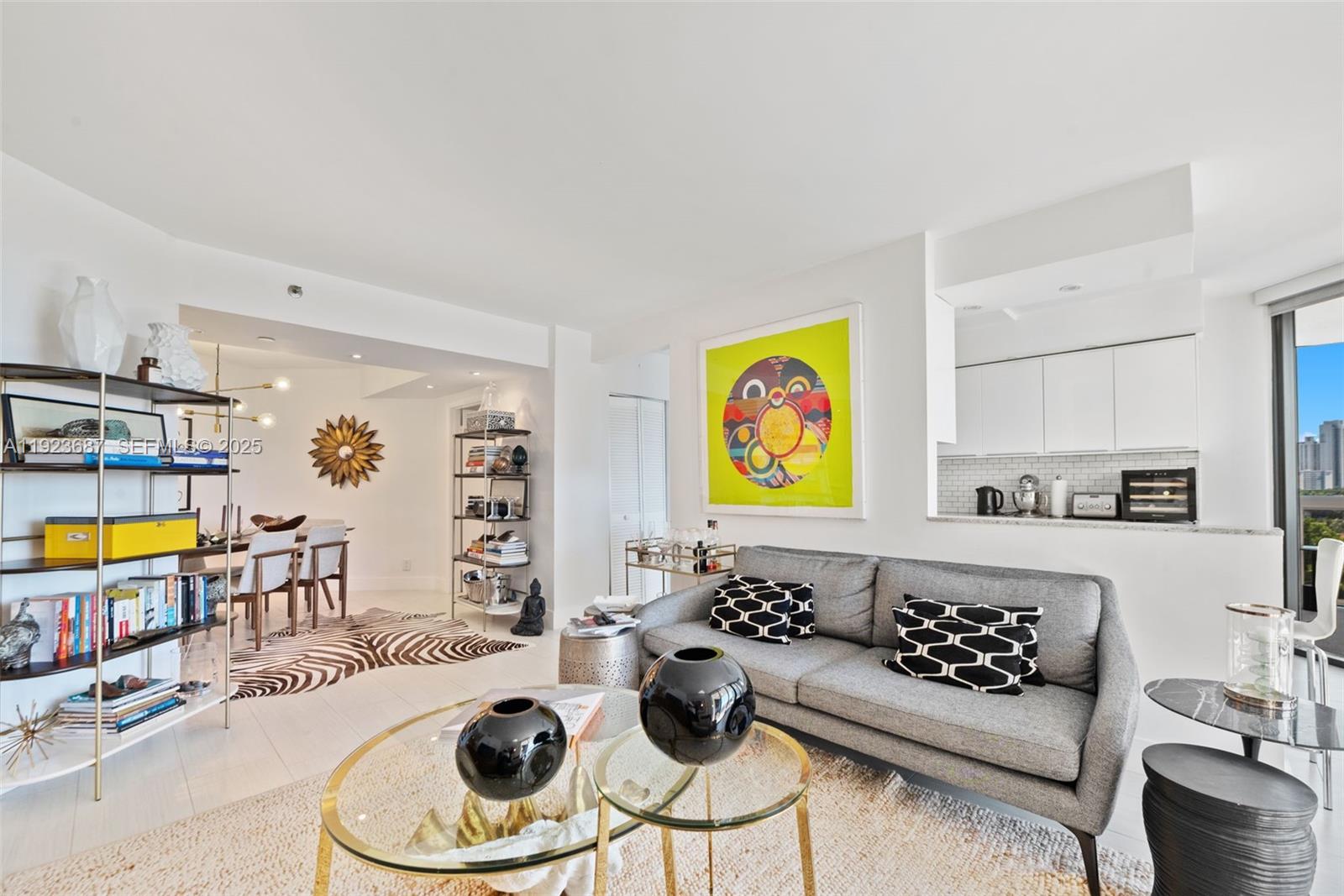 20185 East Country Club Drive, Unit 904 Aventura, FL 33180 - Photo 14 of 29 a living room with furniture kitchen view and a window