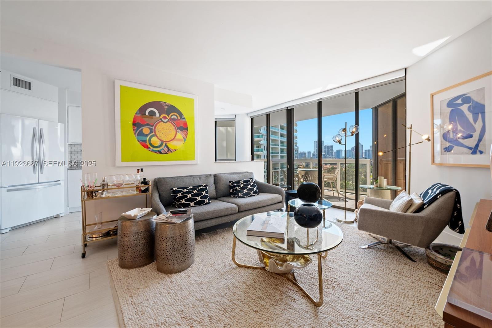 20185 East Country Club Drive, Unit 904 Aventura, FL 33180 - Photo 15 of 29 a living room with furniture and a floor to ceiling window