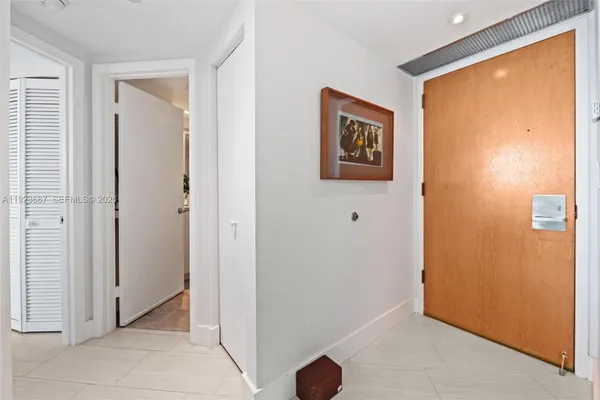a view of a hallway with closet