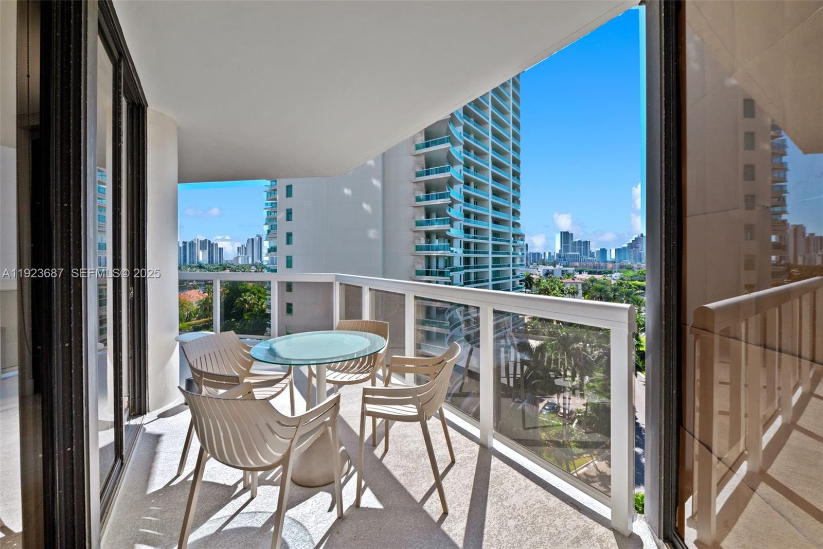 20185 East Country Club Drive, Unit 904 Aventura, FL 33180 - Photo 20 of 29 a view of a chair and table in the balcony