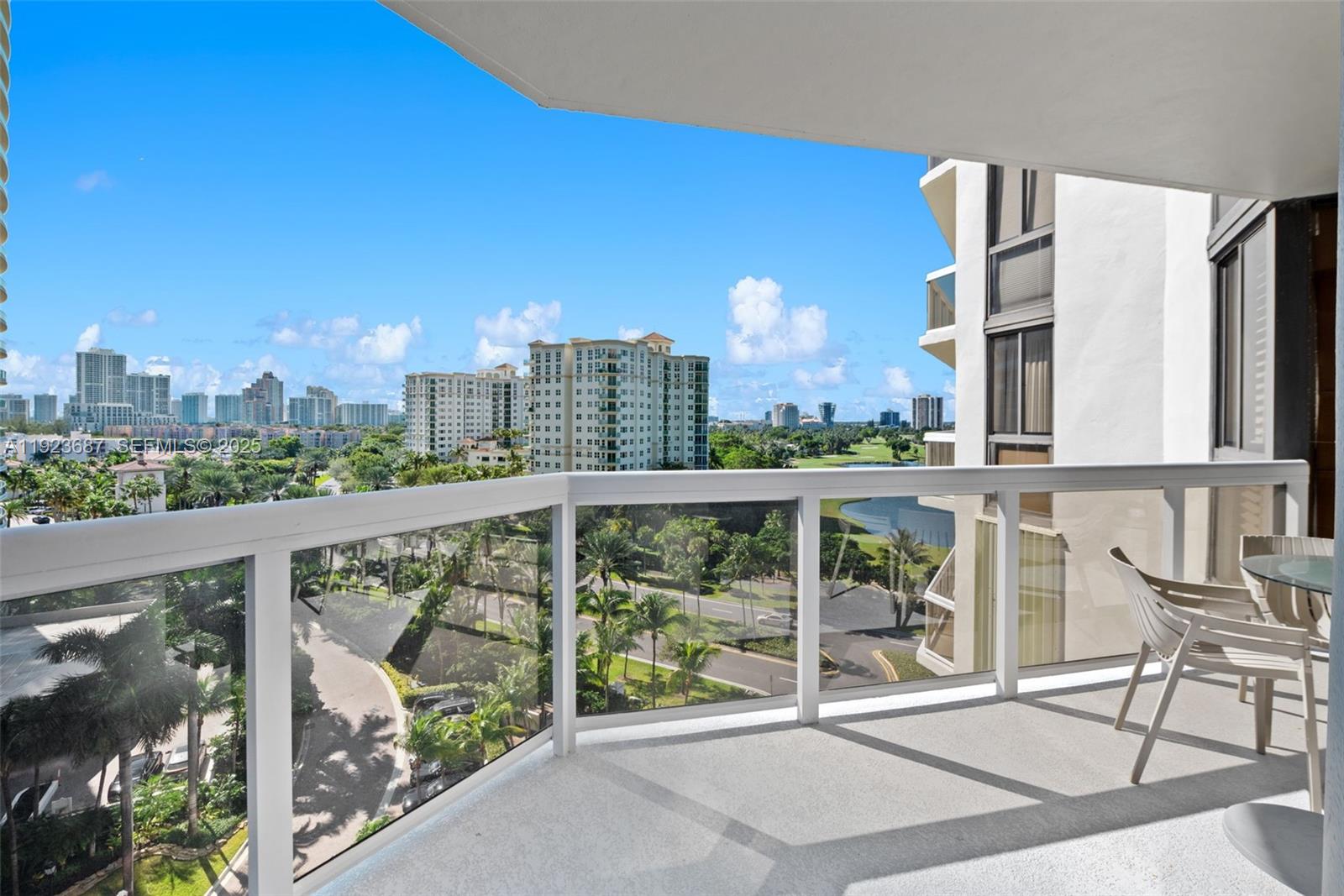 20185 East Country Club Drive, Unit 904 Aventura, FL 33180 - Photo 21 of 29 a view of a city from a balcony