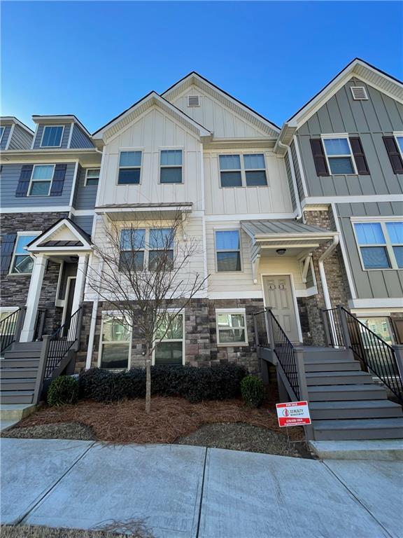 4132 Integrity Way Powder Springs, GA 30127 - Photo 1 of 1 a front view of a house with garage