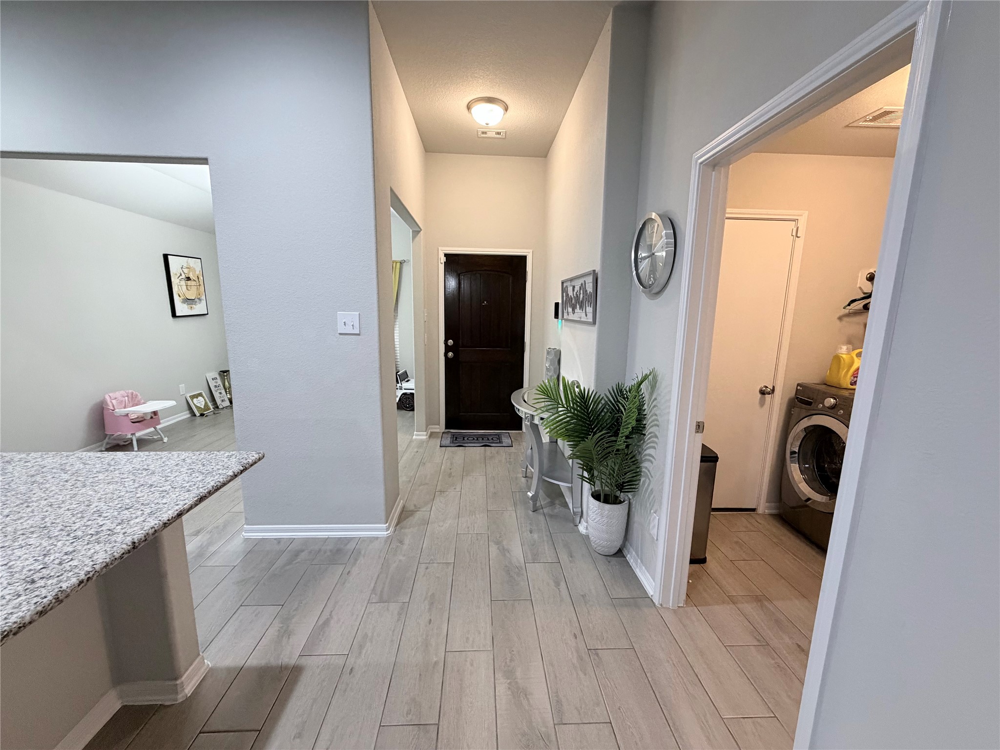 4303 Greeley Lane Rosenberg, TX 77471 - Photo 28 of 30 a view of a hallway to a livingroom and a microwave