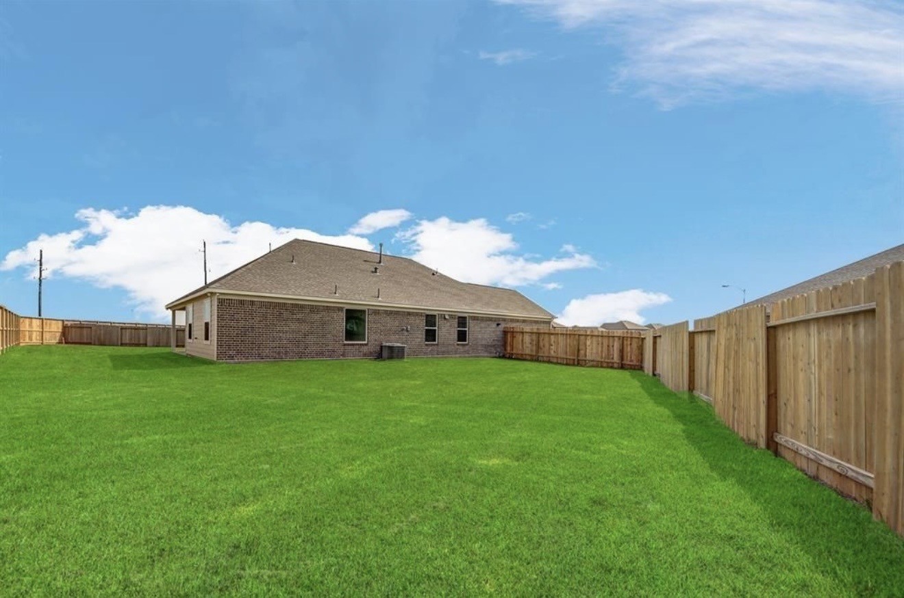4303 Greeley Lane Rosenberg, TX 77471 - Photo 5 of 30 a view of a big yard with potted plants