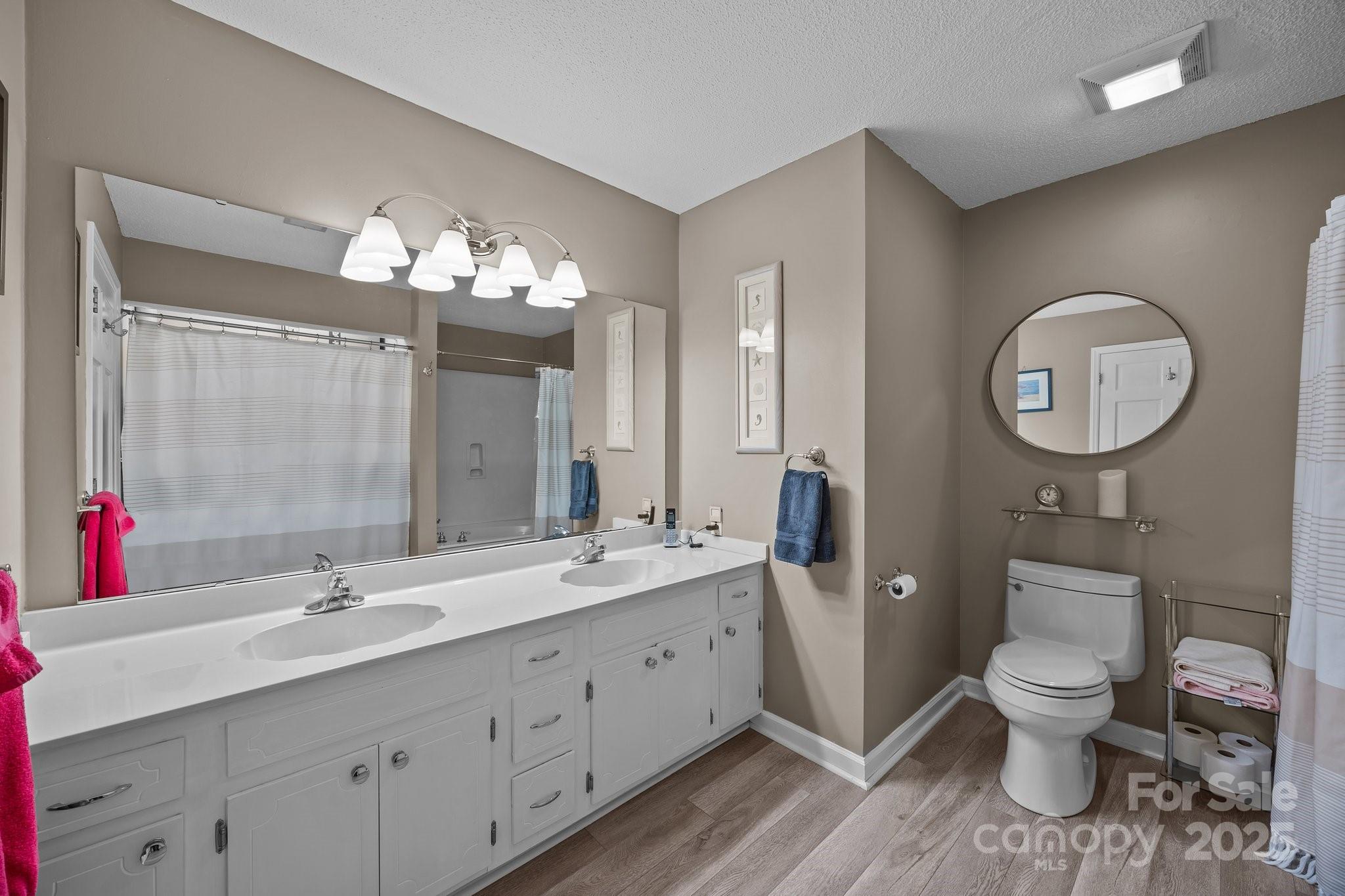 520 Mainsail Road Salisbury, NC 28146 - Photo 13 of 47 a spacious bathroom with a toilet sink and mirror