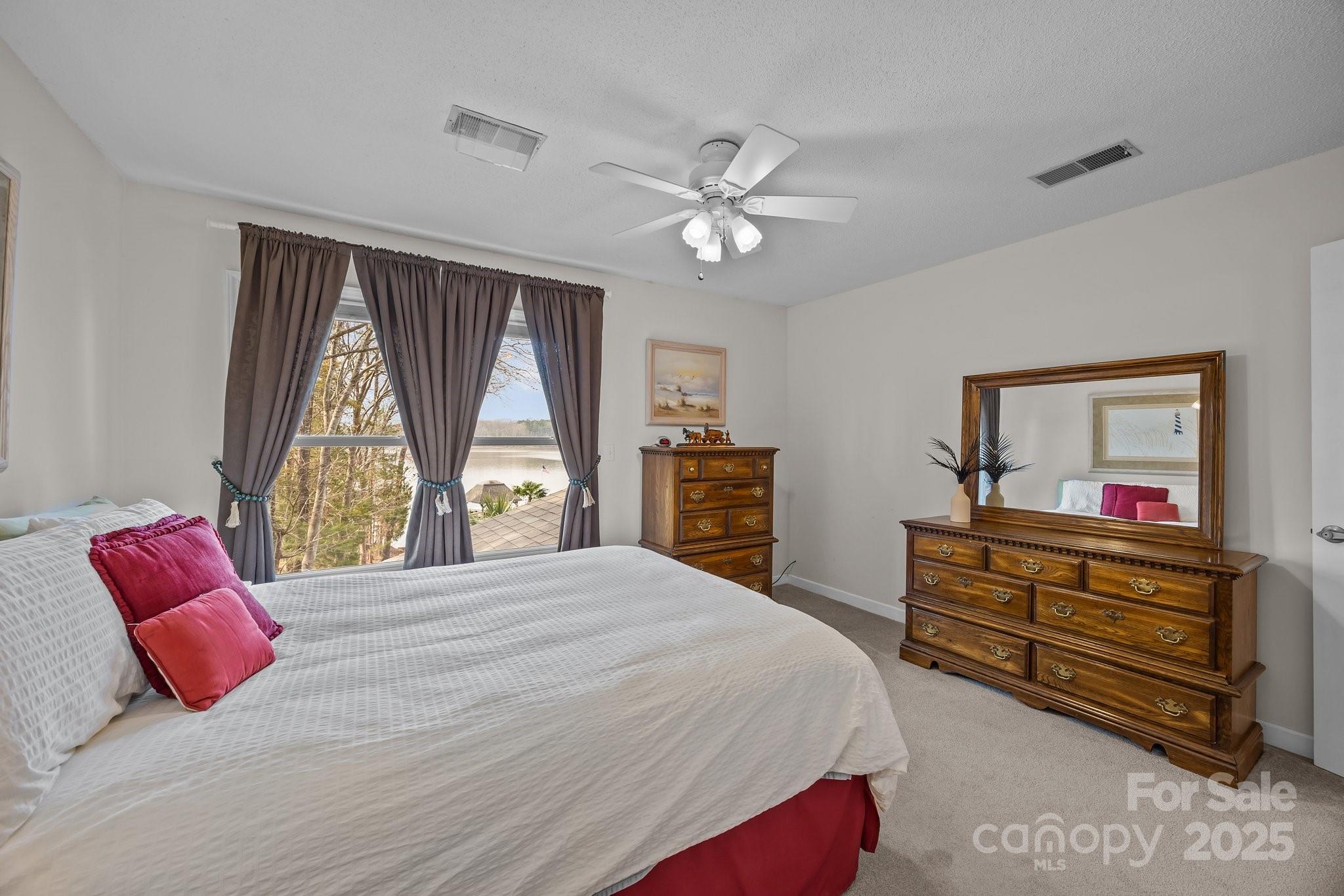 520 Mainsail Road Salisbury, NC 28146 - Photo 15 of 47 a bedroom with a large bed and a window