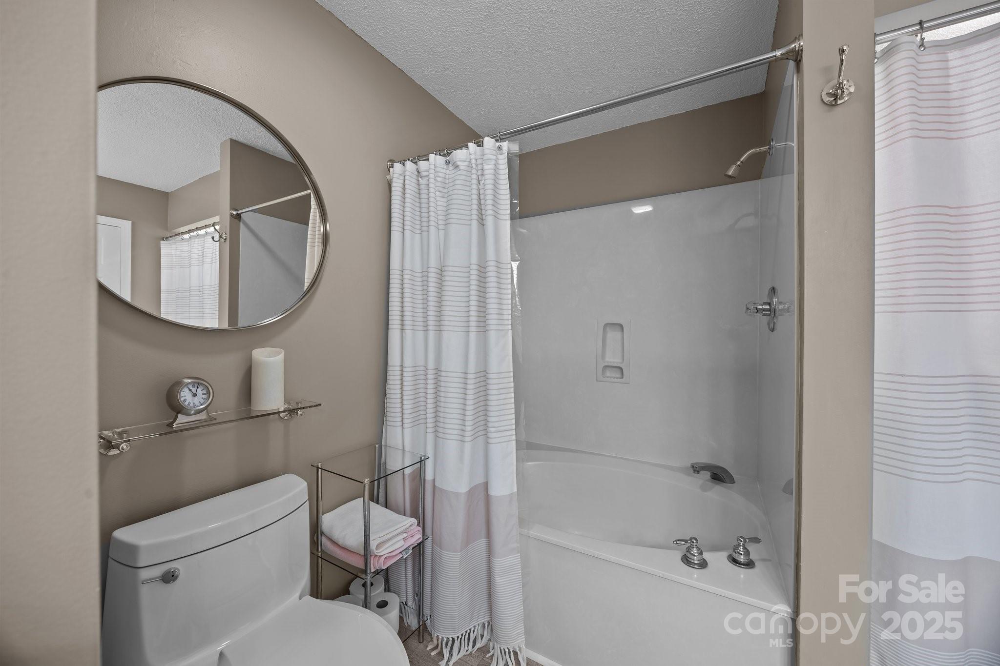 520 Mainsail Road Salisbury, NC 28146 - Photo 16 of 47 a bathroom with a toilet and a mirror
