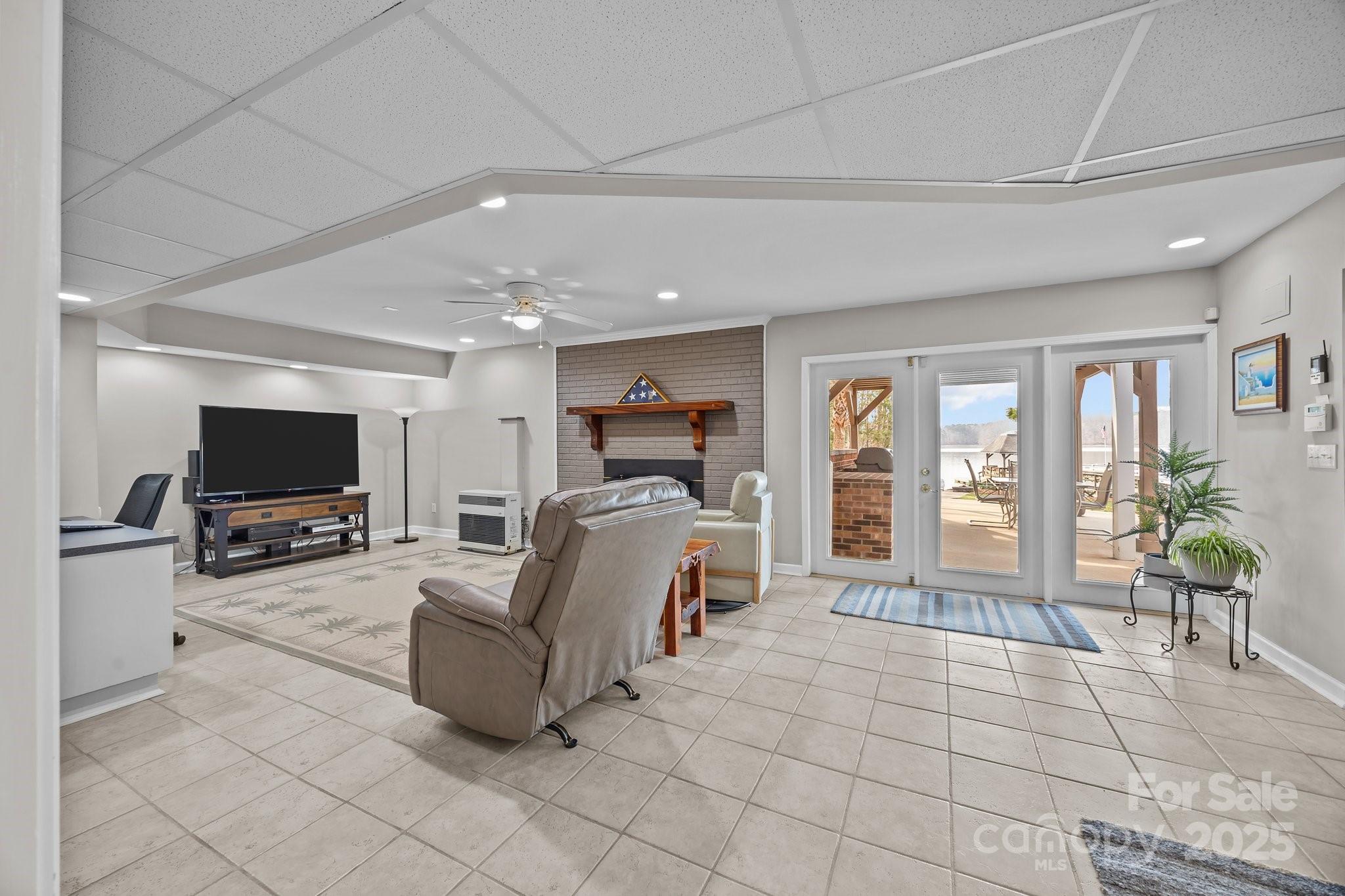 520 Mainsail Road Salisbury, NC 28146 - Photo 18 of 47 a living room with furniture and a flat screen tv