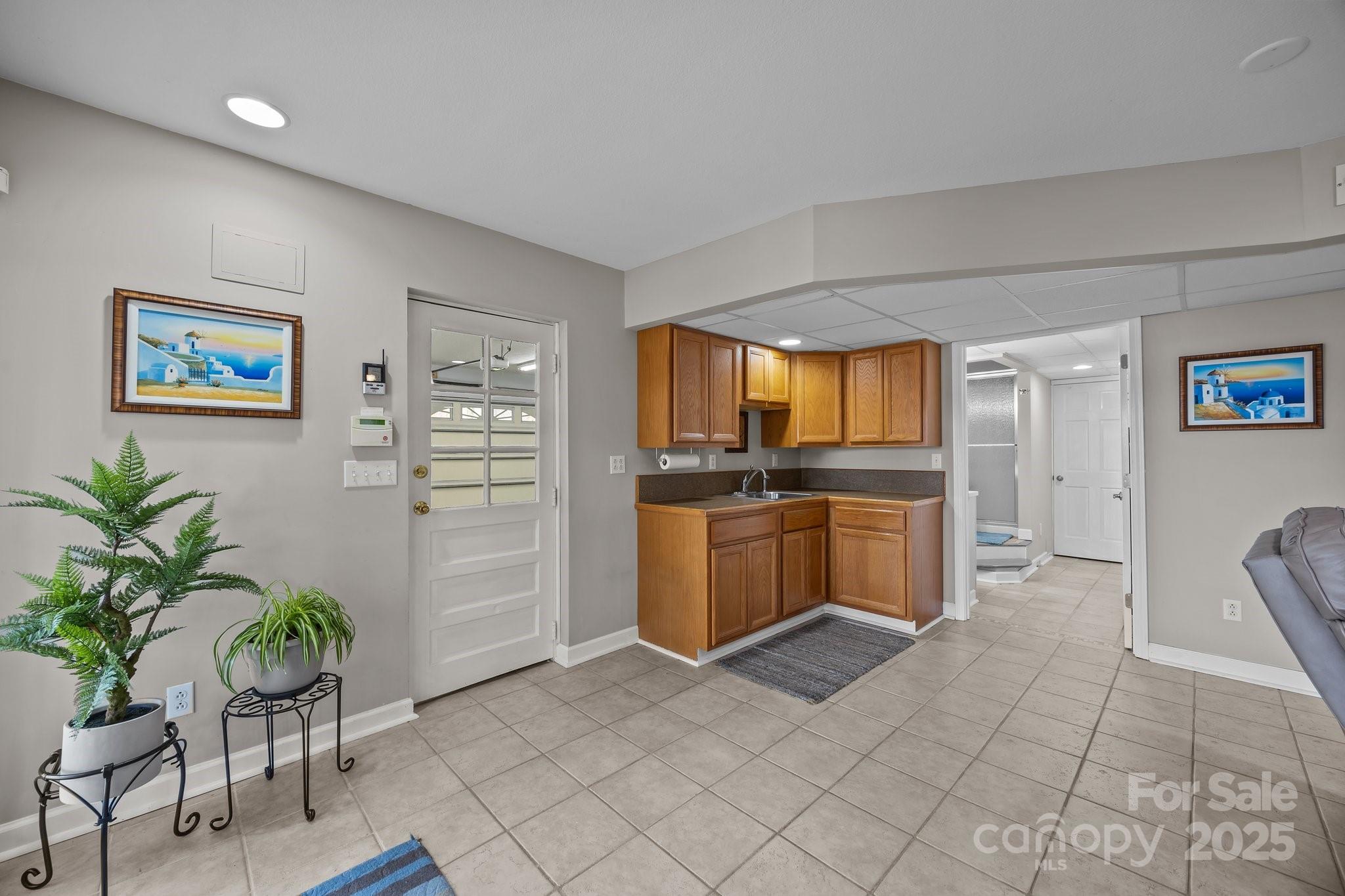 520 Mainsail Road Salisbury, NC 28146 - Photo 19 of 47 a kitchen with granite countertop a refrigerator and a sink