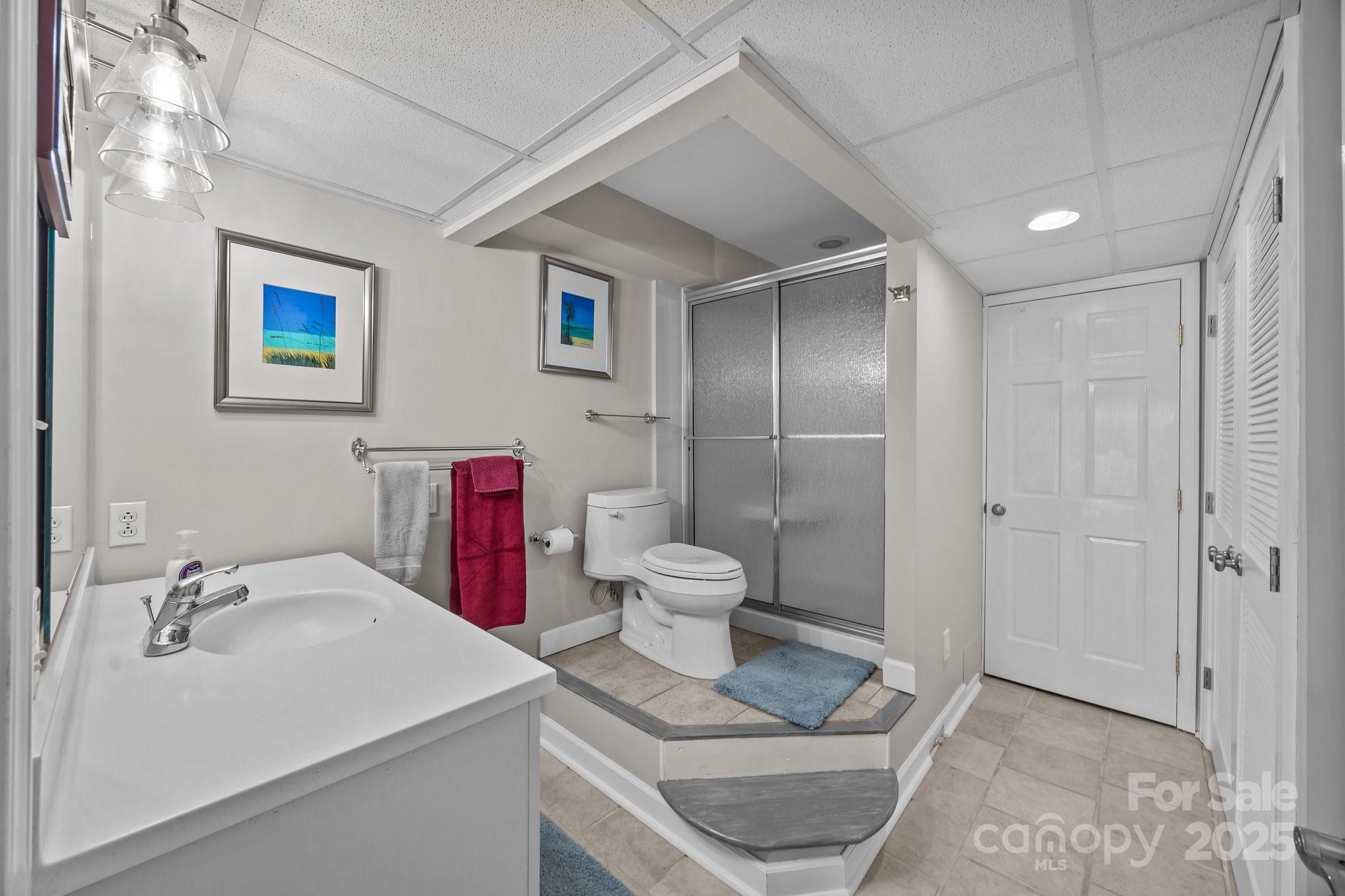 520 Mainsail Road Salisbury, NC 28146 - Photo 21 of 47 a bathroom with a sink a toilet and shower