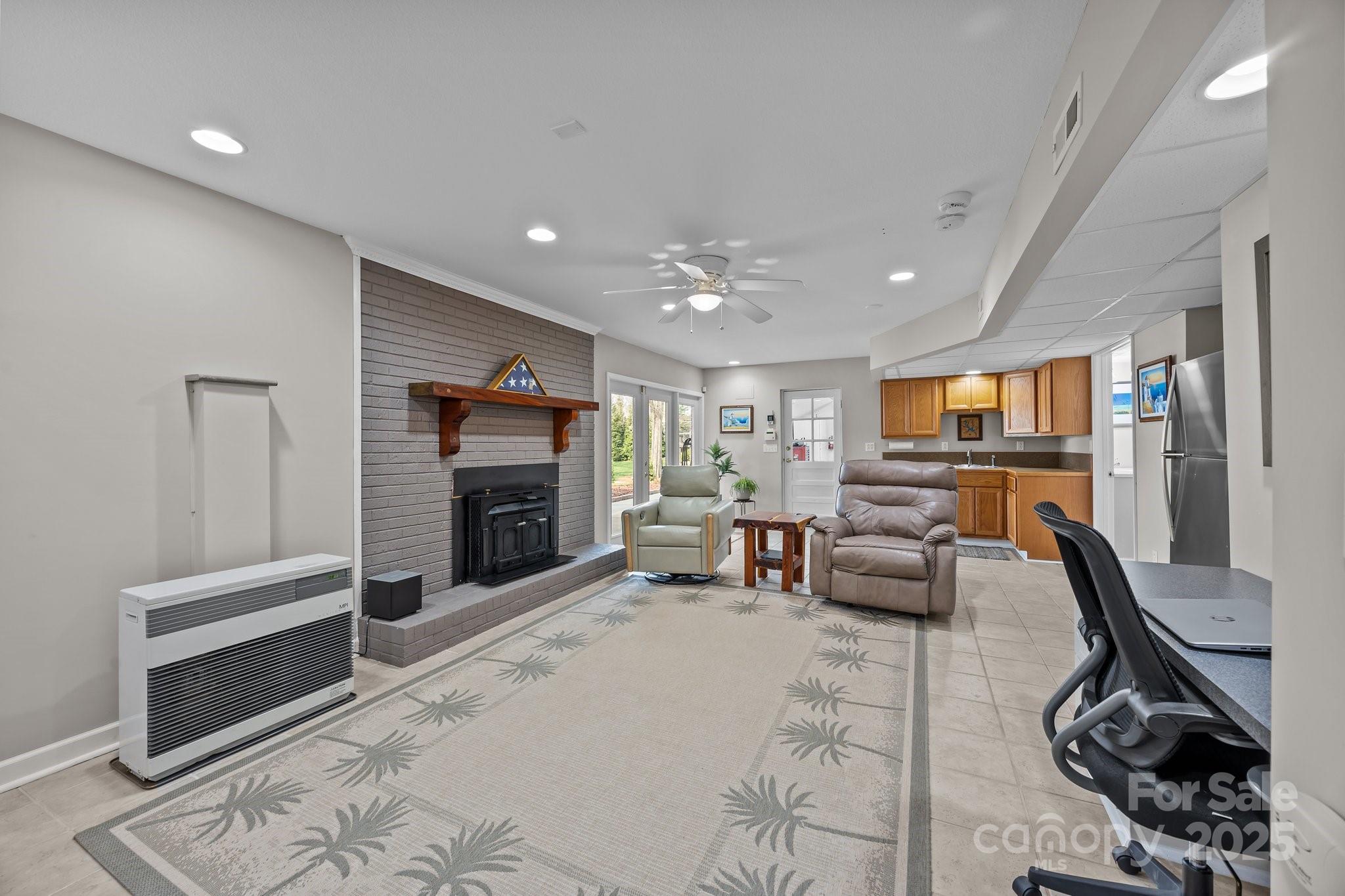 520 Mainsail Road Salisbury, NC 28146 - Photo 23 of 47 a living room with furniture and a flat screen tv