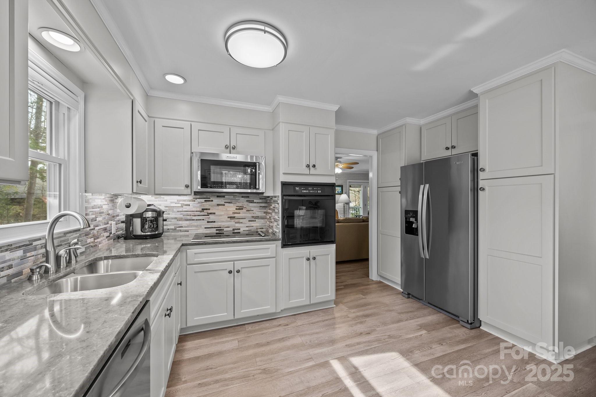 520 Mainsail Road Salisbury, NC 28146 - Photo 24 of 47 a kitchen with stainless steel appliances granite countertop a refrigerator stove microwave and sink