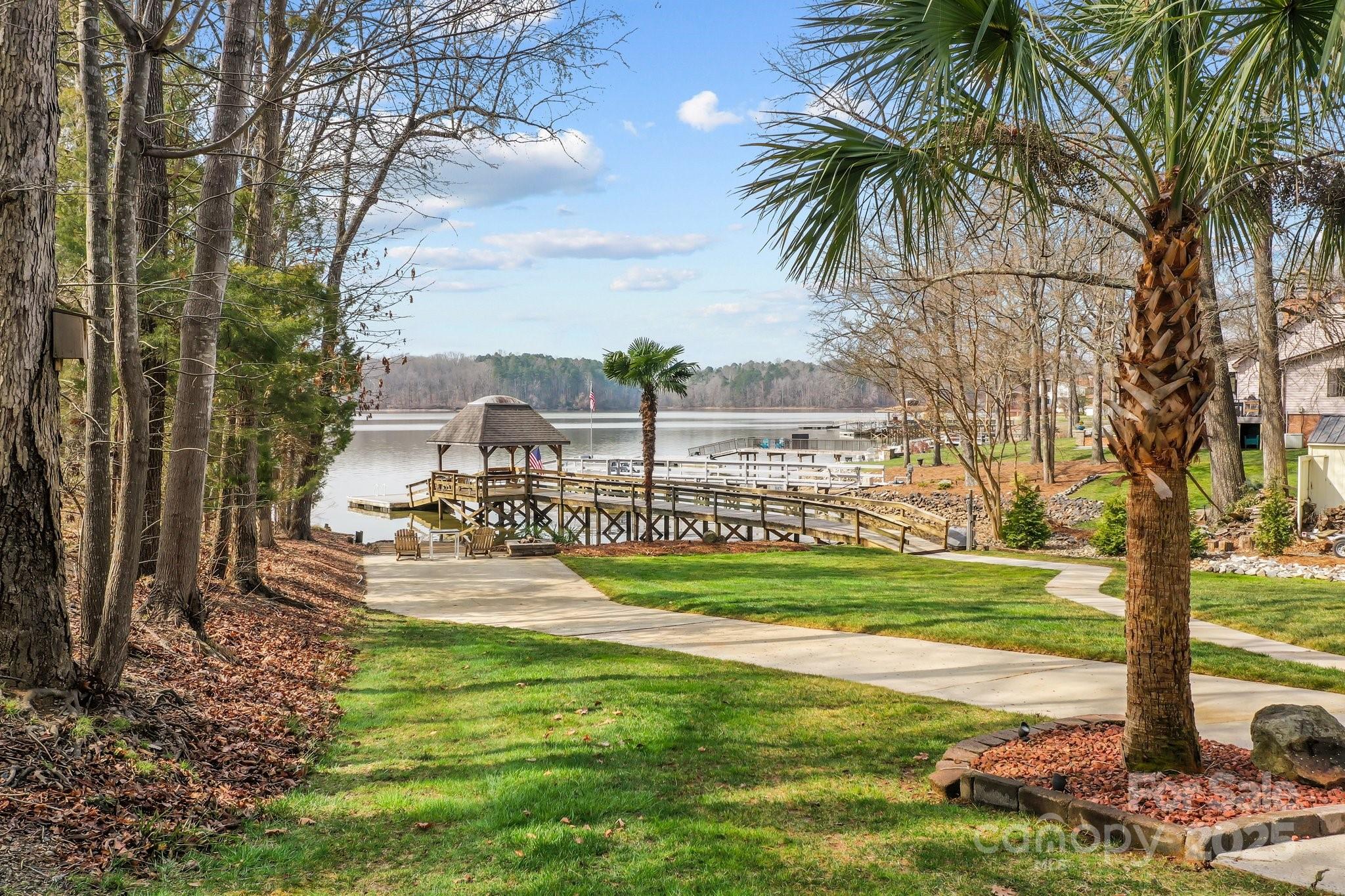 520 Mainsail Road Salisbury, NC 28146 - Photo 3 of 47 a view of a yard with palm trees