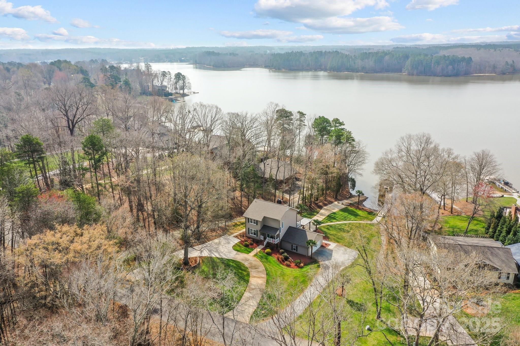 520 Mainsail Road Salisbury, NC 28146 - Photo 32 of 47 a view of a lake with a mountain in the background