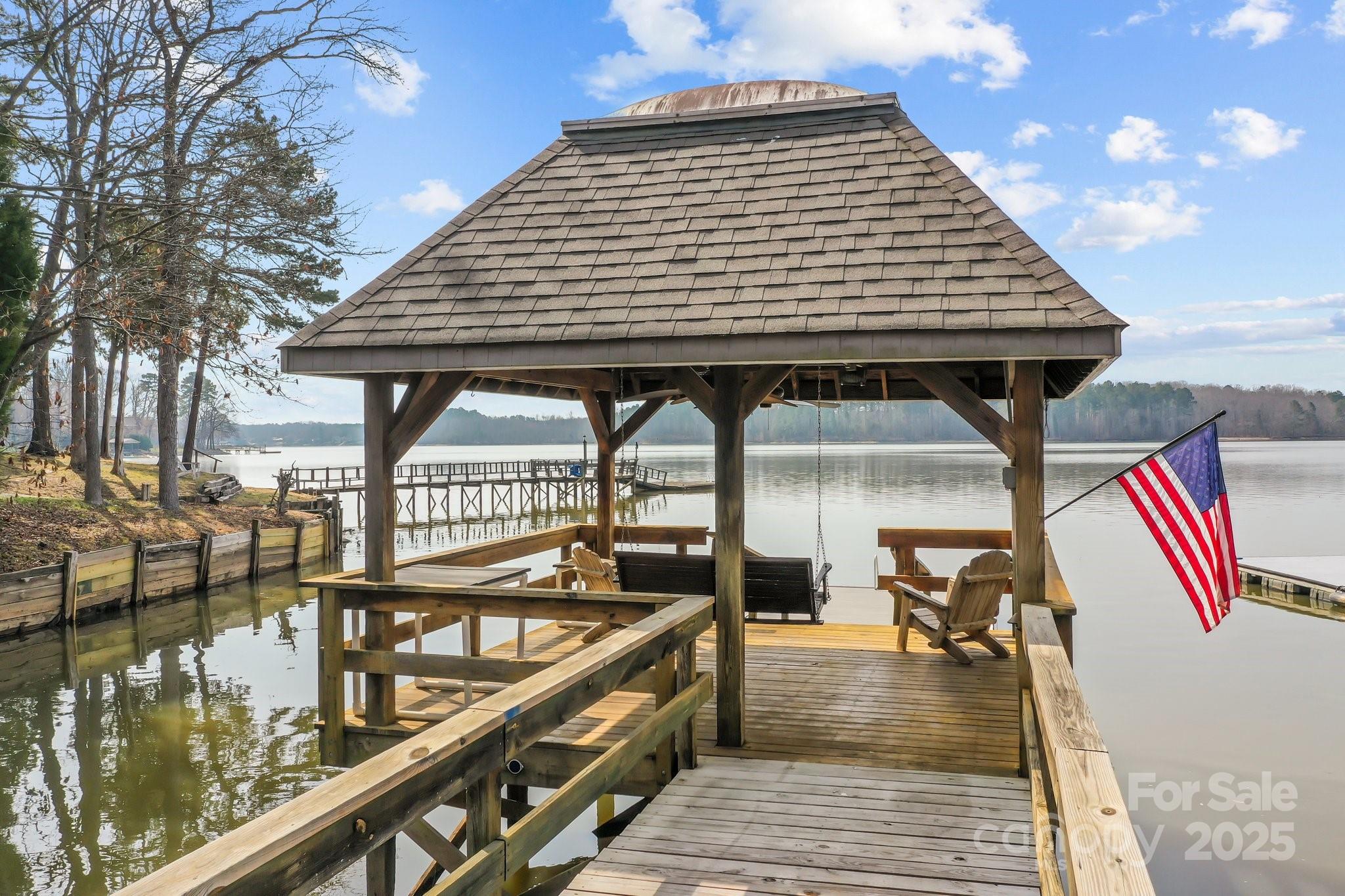 520 Mainsail Road Salisbury, NC 28146 - Photo 36 of 47 a roof deck with table and chairs with wooden floor
