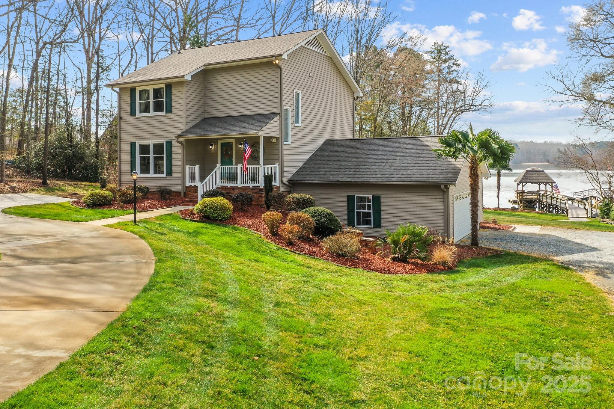 520 Mainsail Road Salisbury, NC 28146 - Photo 39 of 47 a front view of a house with a yard table and chairs