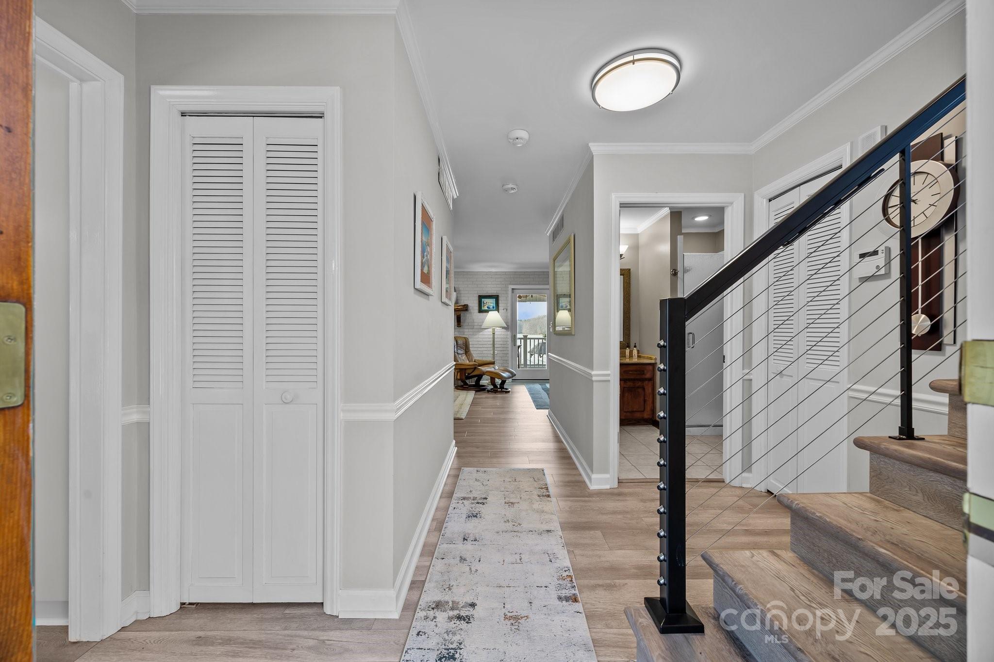 520 Mainsail Road Salisbury, NC 28146 - Photo 6 of 47 a view of a hallway with wooden floor and staircase
