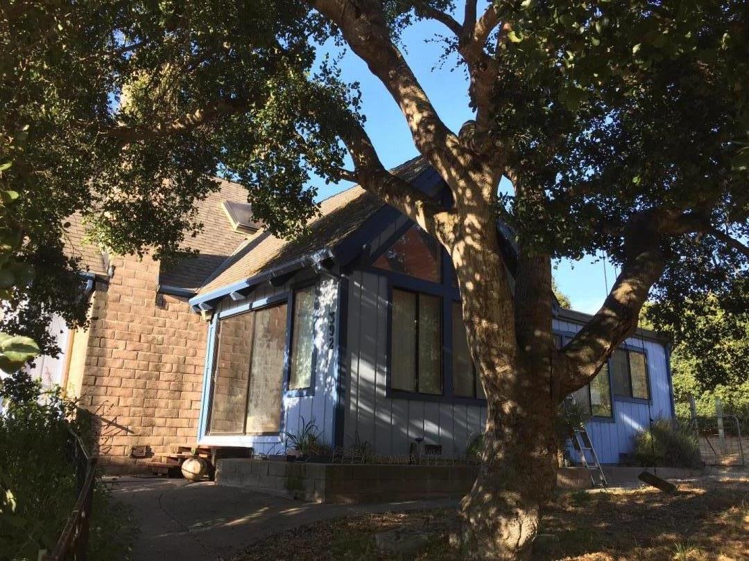 392 Vega Road Watsonville, CA 95076 - Photo 1 of 38 a front view of a house with a yard