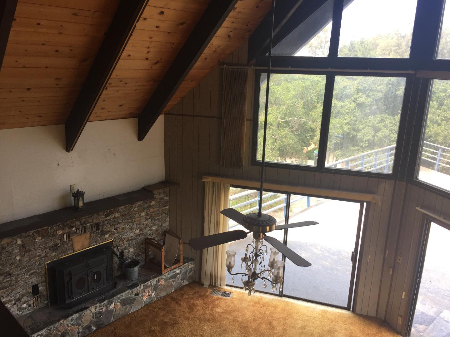 392 Vega Road Watsonville, CA 95076 - Photo 21 of 38 a view of an empty room with wooden floor and a window