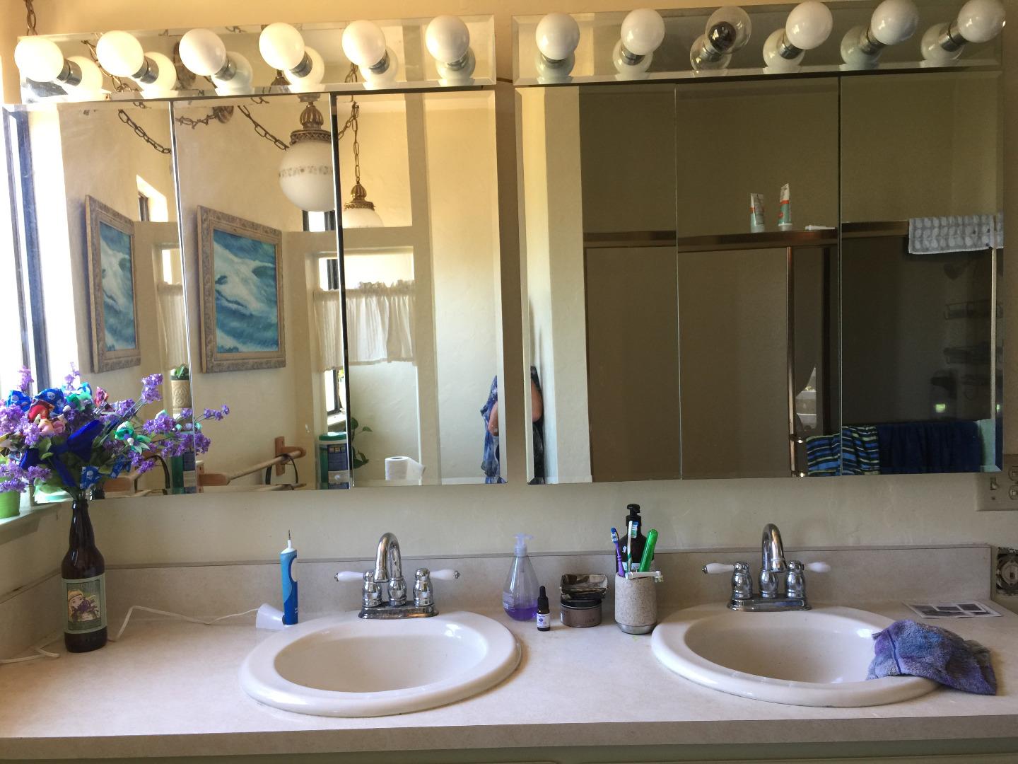 392 Vega Road Watsonville, CA 95076 - Photo 25 of 38 a bathroom with a sink and a mirror