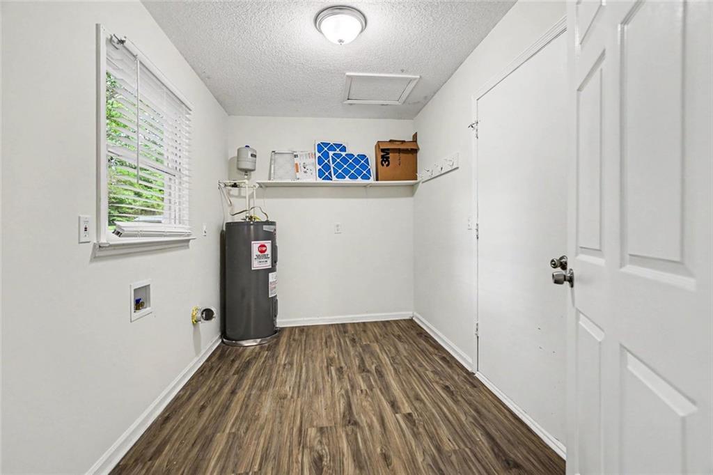 19 Thomas Way Newnan, GA 30263 - Photo 14 of 15 a view of a hallway with wooden floor and closet