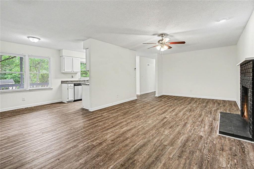 19 Thomas Way Newnan, GA 30263 - Photo 10 of 15 a view of empty room with wooden floor and fan