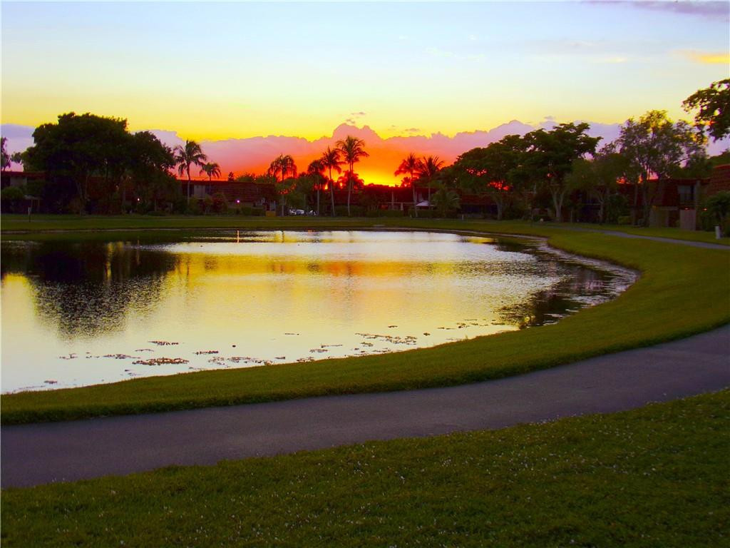 8205 Boca Rio Drive, Unit 8205 Boca Raton, FL 33433 - Photo 1 of 17 a view of a lake with outdoor space