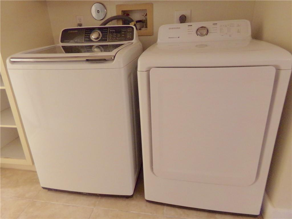 8205 Boca Rio Drive, Unit 8205 Boca Raton, FL 33433 - Photo 13 of 17 a utility room with dryer and washer