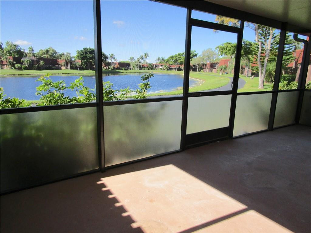 8205 Boca Rio Drive, Unit 8205 Boca Raton, FL 33433 - Photo 15 of 17 a view of a lake from a window
