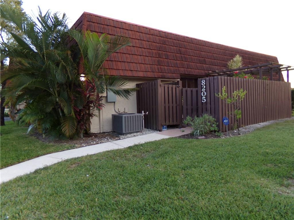 8205 Boca Rio Drive, Unit 8205 Boca Raton, FL 33433 - Photo 16 of 17 a front view of a house with garden