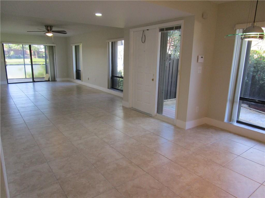 8205 Boca Rio Drive, Unit 8205 Boca Raton, FL 33433 - Photo 5 of 17 an empty room with windows and closet