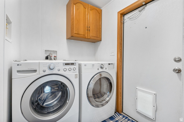 2600 North Hill Field Road, Unit 86 Layton, UT 84041 - Photo 9 of 25 Laundry area featuring washing machine and clothes dryer and cabinet space