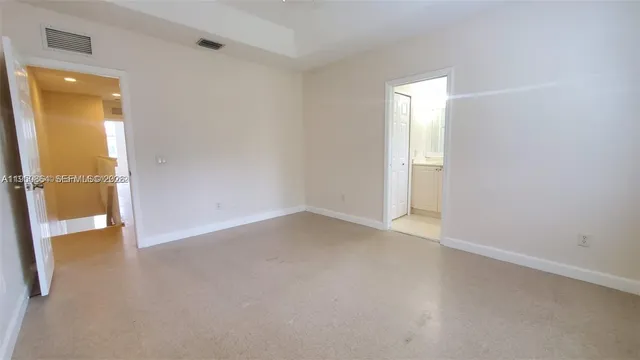 an empty room with a bathroom