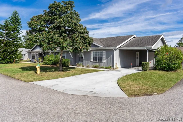 front view of a house with a yard