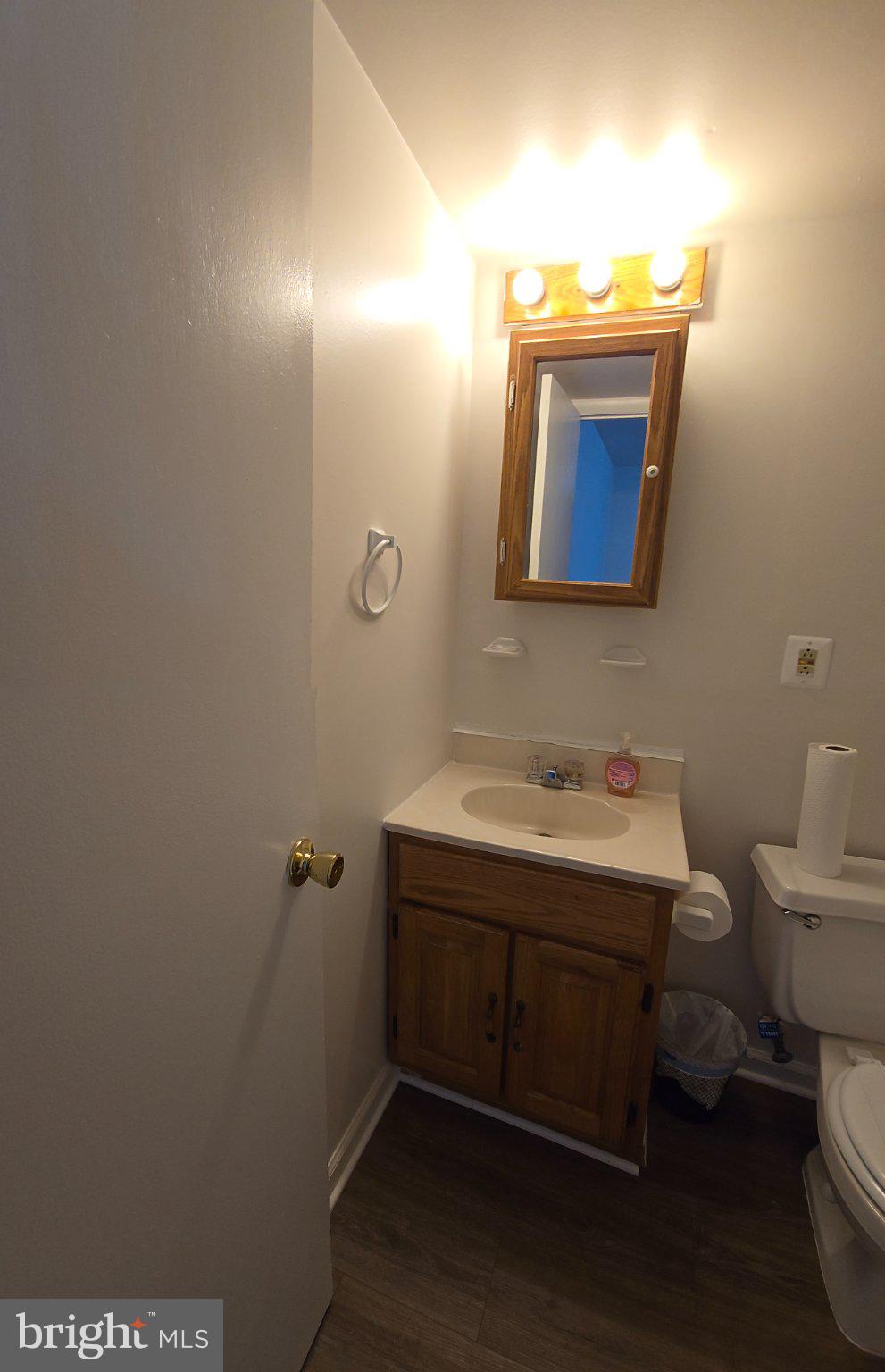 809 St Michaels Drive Bowie, MD 20721 - Photo 7 of 17 a bathroom with a toilet sink and mirror