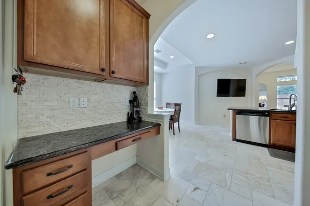 a bathroom with a sink toilet a mirror and shower