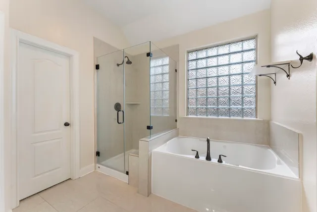 a view of backyard with small cabin and wooden fence