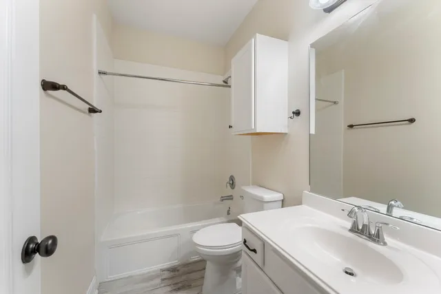 a view of a backyard with a wooden fence