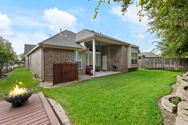 a view of a lake with couches and city view