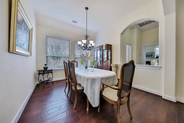 a kitchen with stainless steel appliances granite countertop wooden cabinets a stove top oven a sink and dishwasher