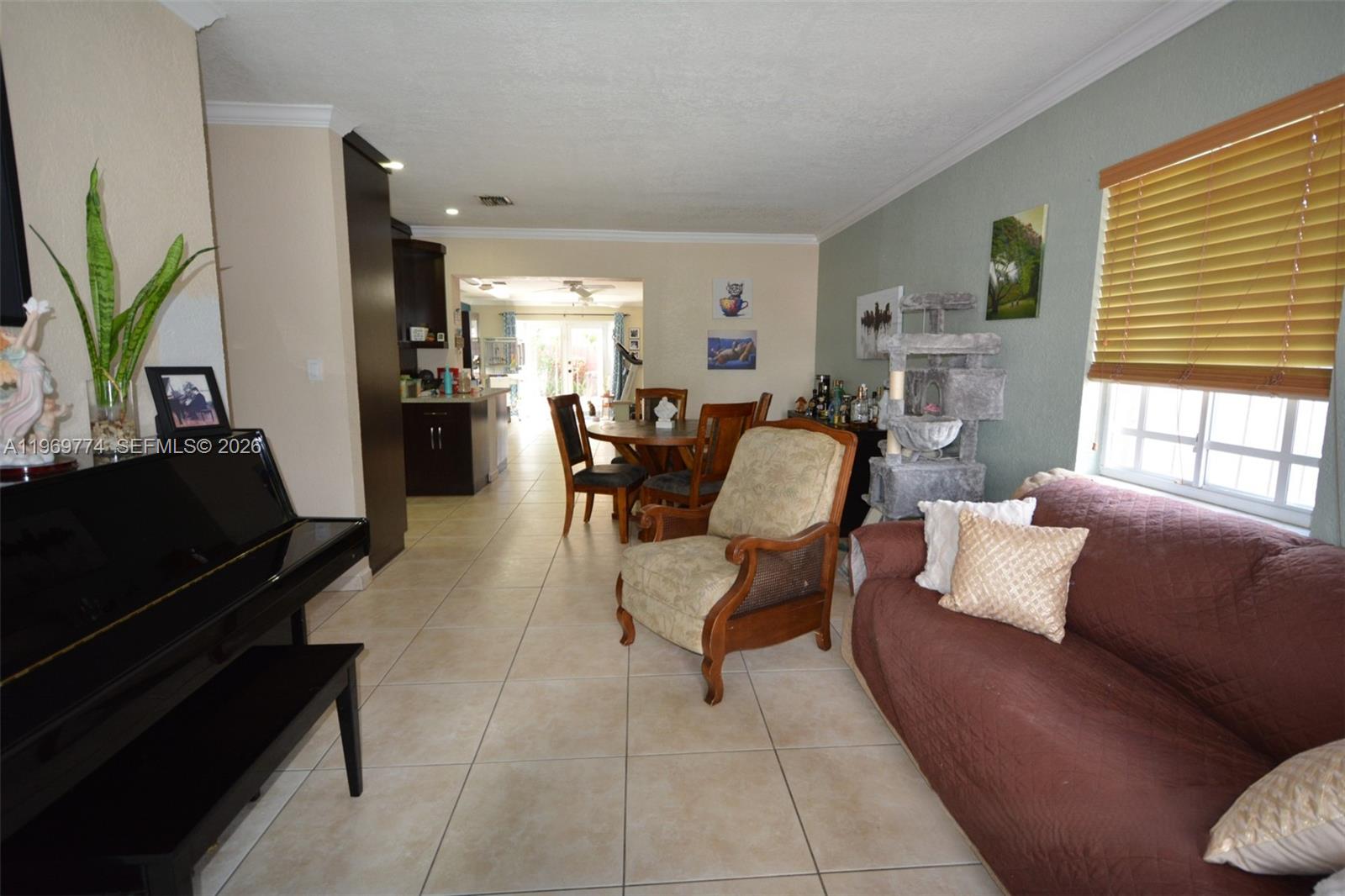 890 East 38th Street Hialeah, FL 33013 - Photo 1 of 30 a living room with furniture and a flat screen tv