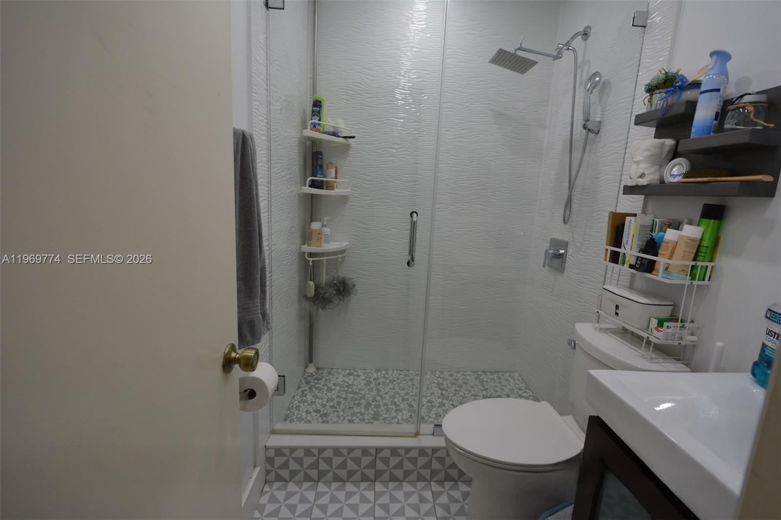 890 East 38th Street Hialeah, FL 33013 - Photo 11 of 30 a bathroom with a toilet and a shower