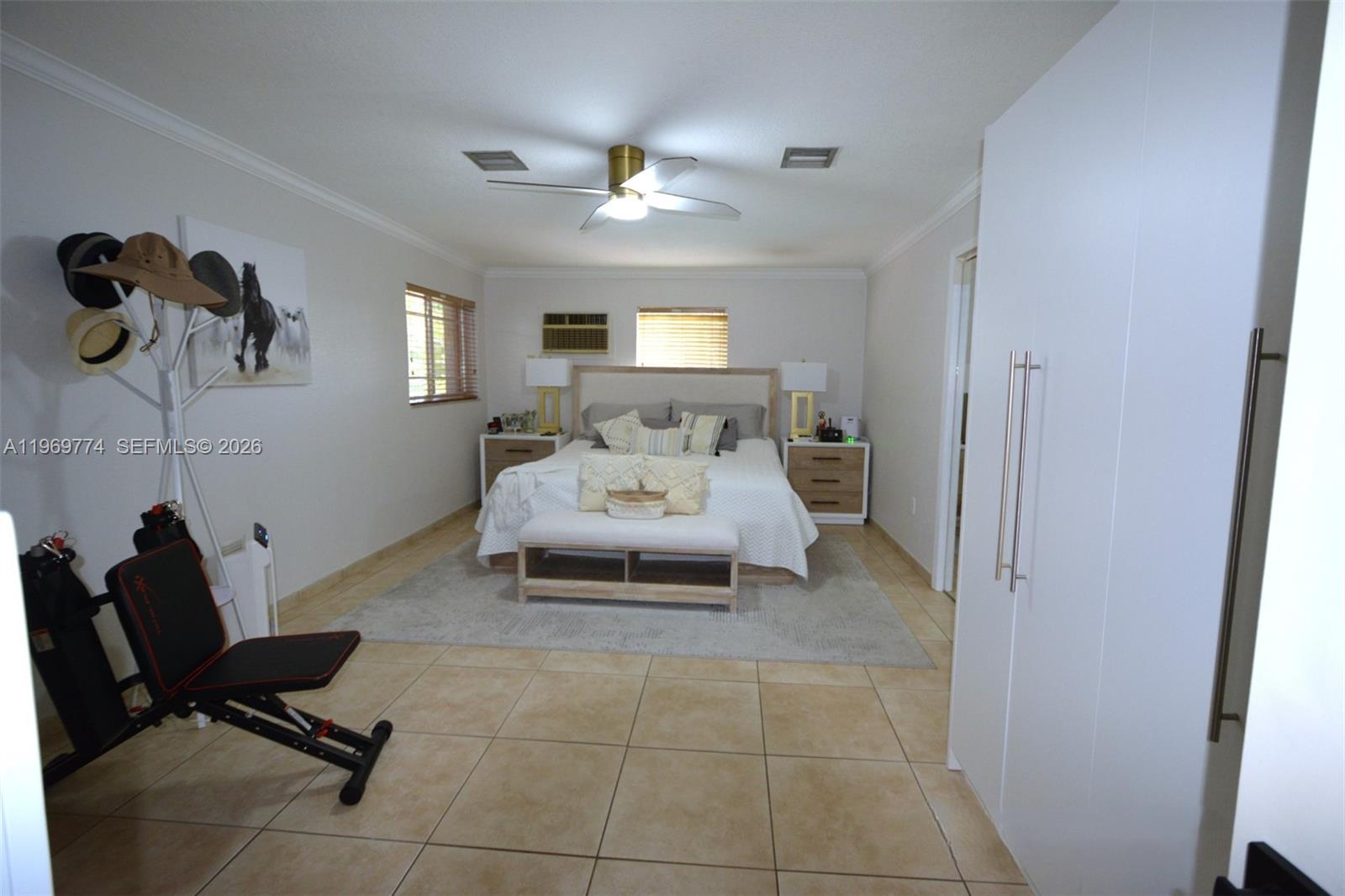 890 East 38th Street Hialeah, FL 33013 - Photo 13 of 30 a living room with furniture and a chandelier