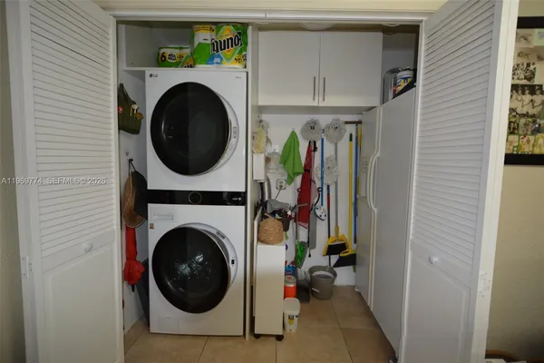 a view of a hallway with washer and dryer