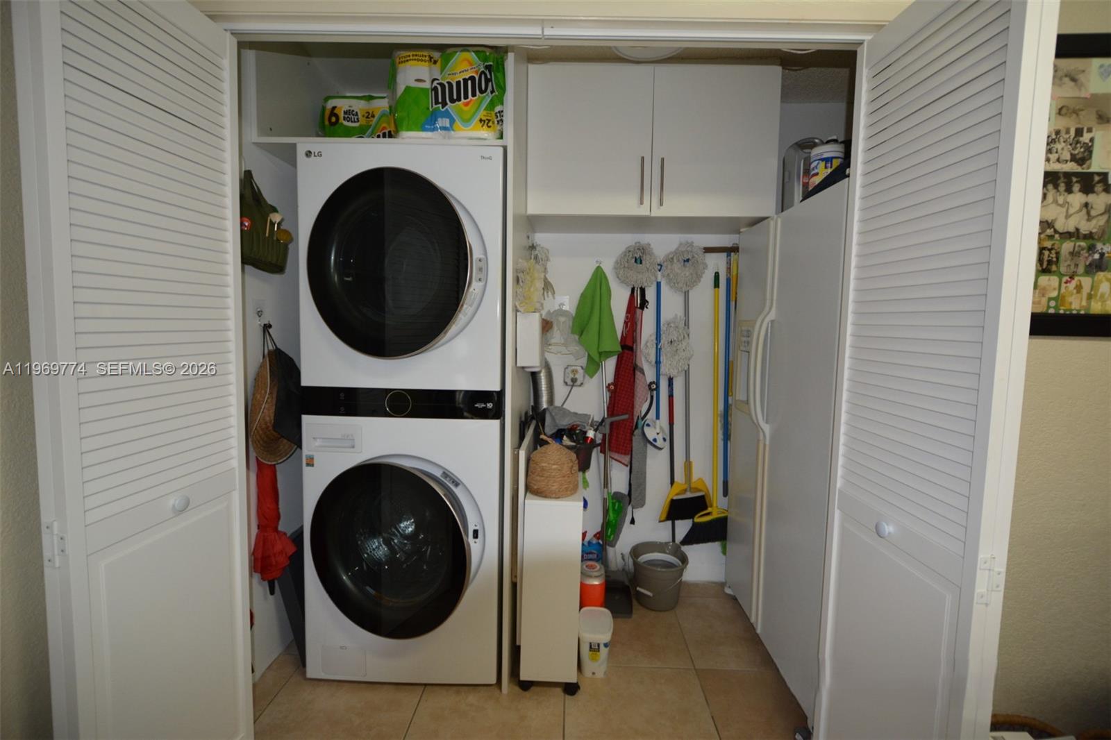 890 East 38th Street Hialeah, FL 33013 - Photo 20 of 30 a view of a hallway with washer and dryer