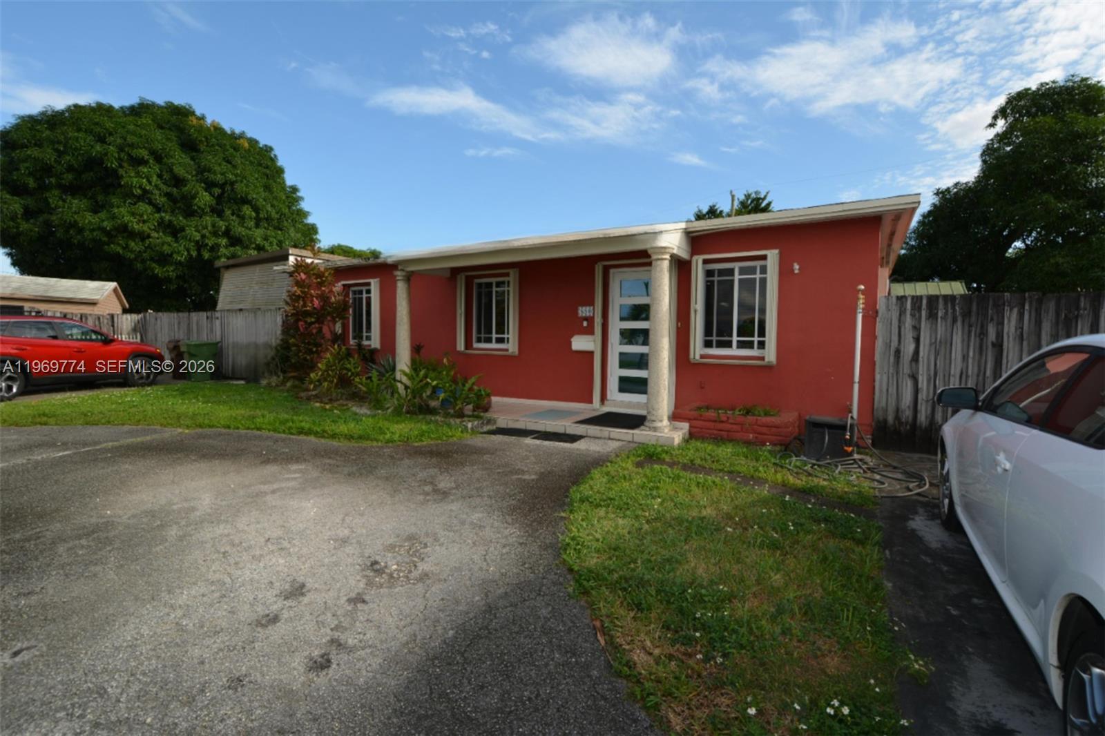 890 East 38th Street Hialeah, FL 33013 - Photo 2 of 30 a front view of house with yard and green space